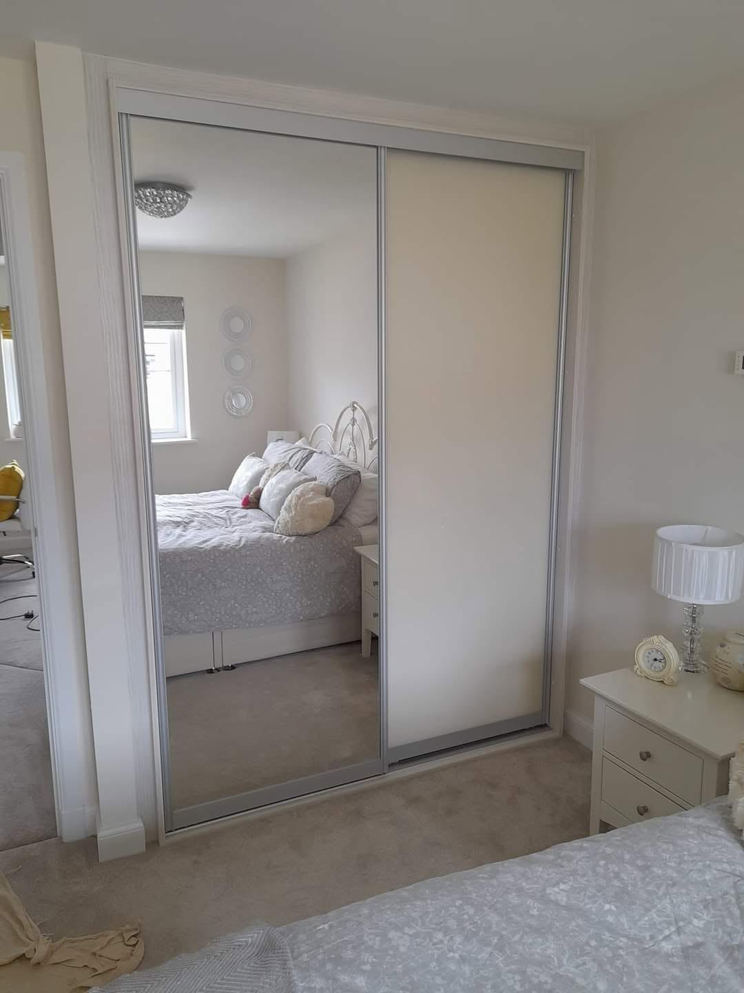 Two-door sliding wardrobe with mirror and cream glass panels, Edinburgh